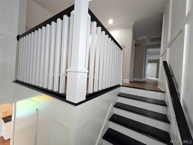 staircase with hardwood / wood-style floors