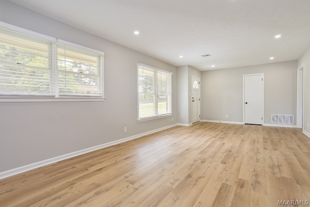 empty room with light wood-type flooring