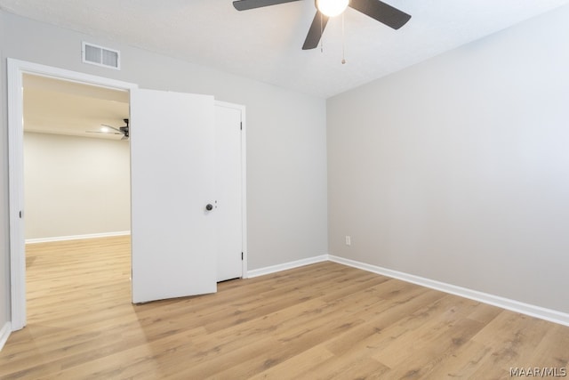 spare room with ceiling fan and light hardwood / wood-style flooring