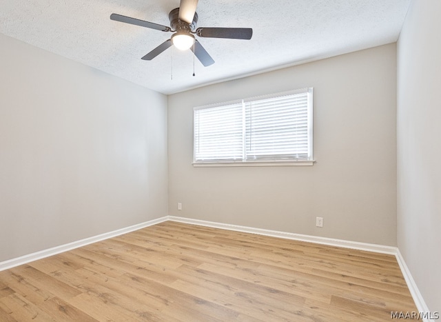 unfurnished room featuring light hardwood / wood-style flooring, a textured ceiling, and ceiling fan