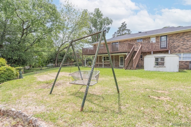 view of yard featuring an outdoor structure and a wooden deck