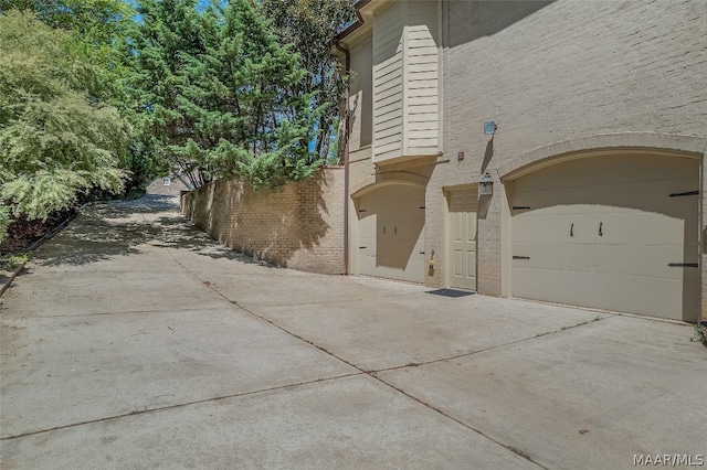 view of side of property with a garage