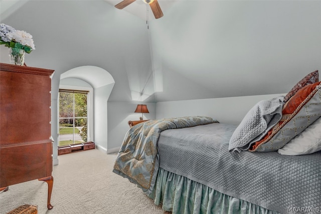 bedroom with lofted ceiling, ceiling fan, and carpet flooring