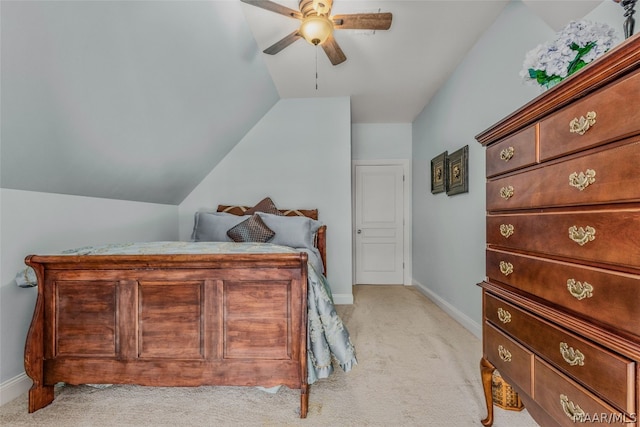 carpeted bedroom with ceiling fan and lofted ceiling