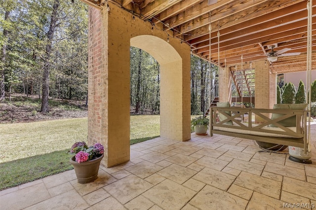 view of patio featuring ceiling fan