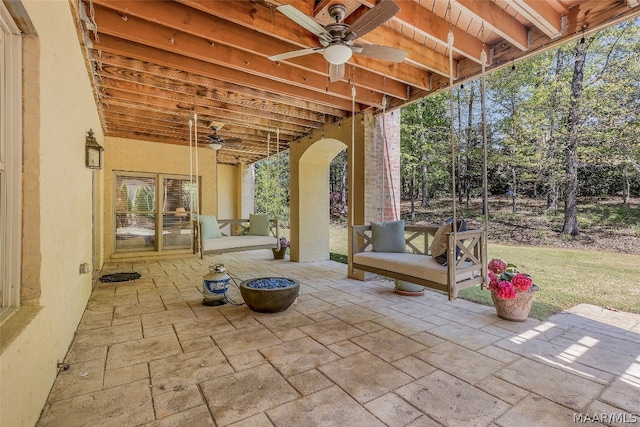 view of patio featuring ceiling fan