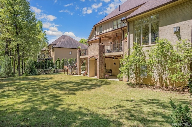 view of yard featuring a balcony