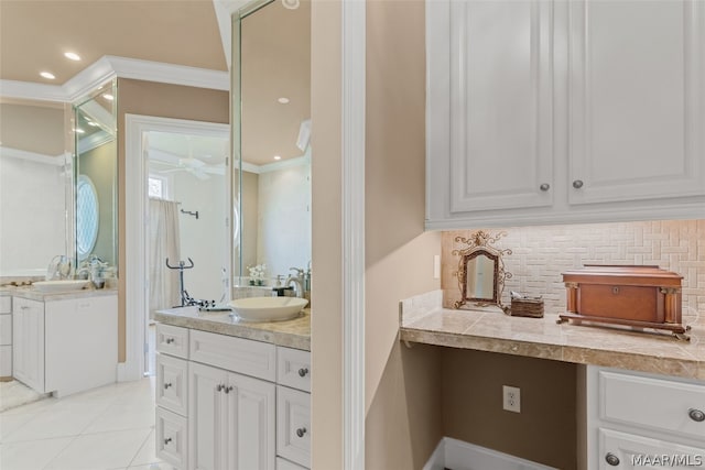 bathroom featuring crown molding, double vanity, tile floors, and tasteful backsplash