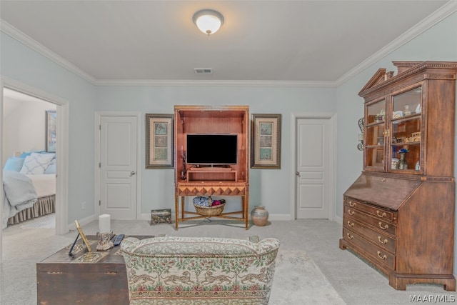 carpeted living room featuring ornamental molding