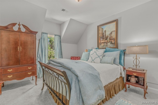 carpeted bedroom featuring lofted ceiling