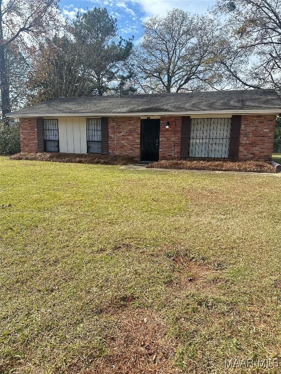 ranch-style house with a front lawn