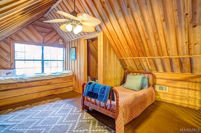 bedroom with ceiling fan, wooden walls, and vaulted ceiling