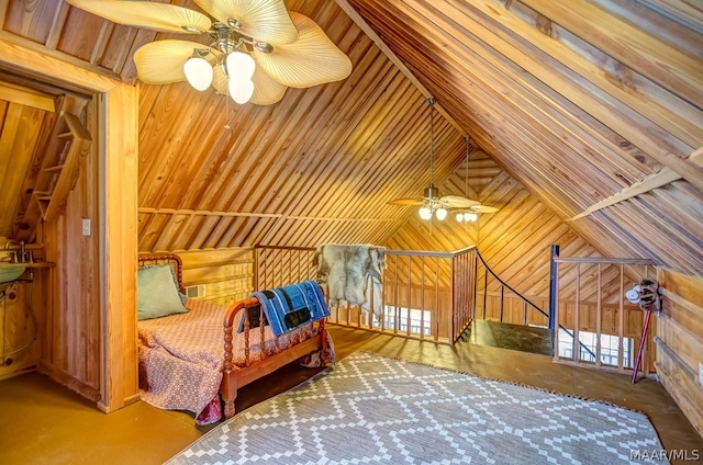 bedroom featuring vaulted ceiling and wooden walls