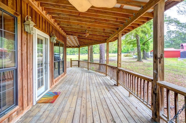 deck with ceiling fan and a porch