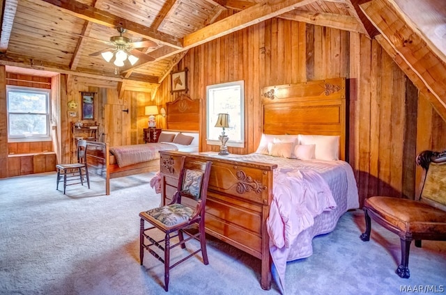 carpeted bedroom featuring vaulted ceiling with beams, wood walls, ceiling fan, and wood ceiling