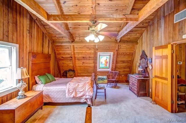 bedroom with beamed ceiling, ceiling fan, light colored carpet, and wood ceiling