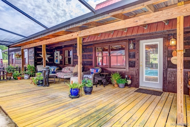 wooden terrace with an outdoor hangout area