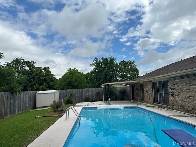 view of pool featuring a lawn and a shed