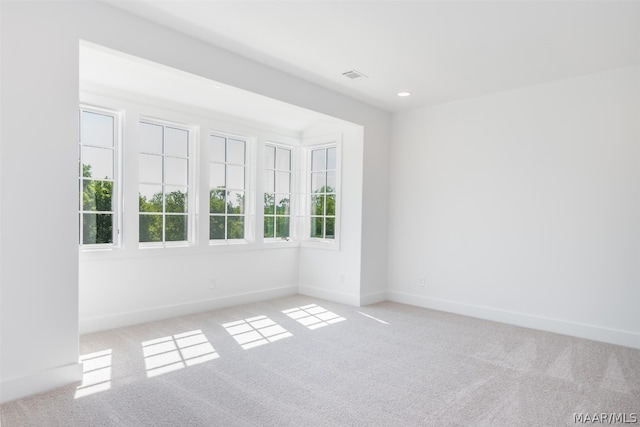 empty room with light colored carpet