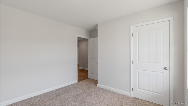 unfurnished bedroom with light carpet