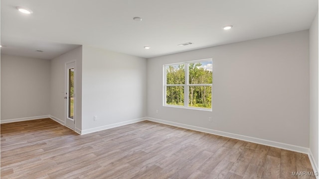 empty room with light wood-type flooring