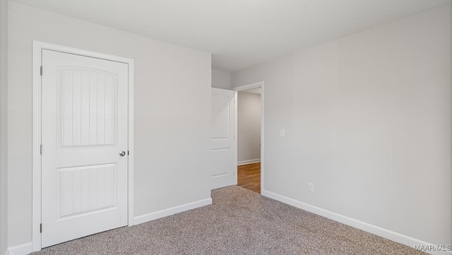 unfurnished bedroom with carpet flooring