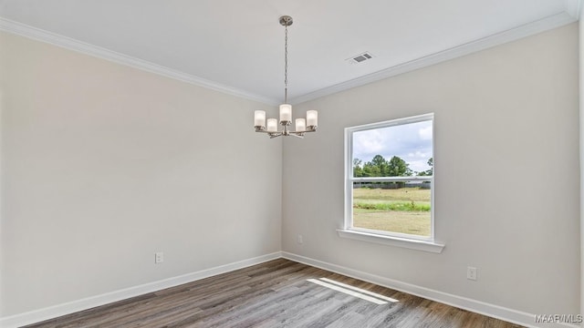 6601 Firefly Ln, Montgomery, AL 36116 - unfurnished room with a chandelier, wood finished floors, ornamental molding, and baseboards