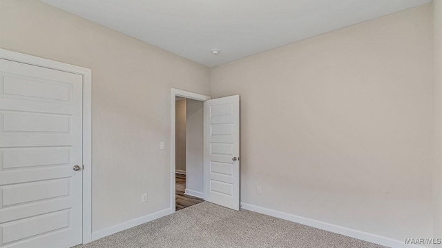 6601 Firefly Ln, Montgomery, AL 36116 - unfurnished bedroom featuring carpet floors and baseboards