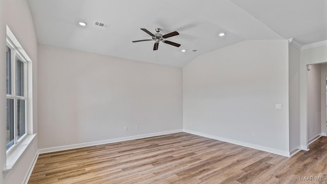 6601 Firefly Ln, Montgomery, AL 36116 - unfurnished room with ceiling fan, wood finished floors, vaulted ceiling, recessed lighting, and baseboards
