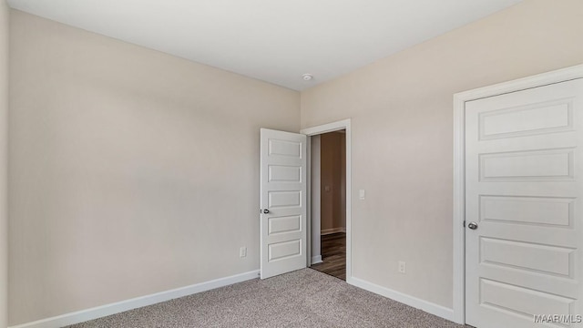 6601 Firefly Ln, Montgomery, AL 36116 - unfurnished bedroom with baseboards and carpet