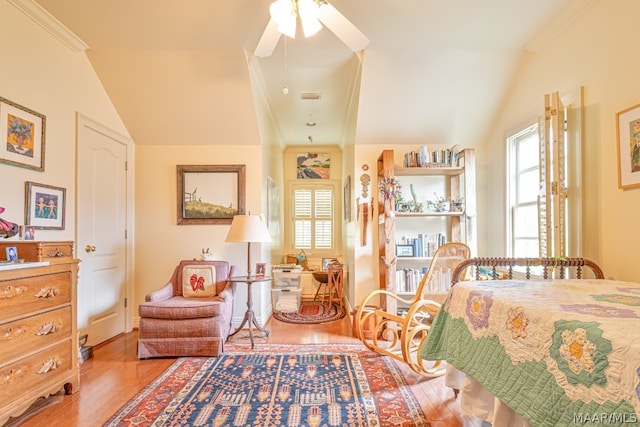 bedroom featuring wood-type flooring, ceiling fan, crown molding, and multiple windows