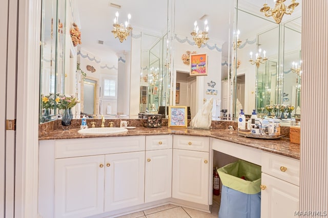 bathroom featuring ornamental molding, tile flooring, and vanity