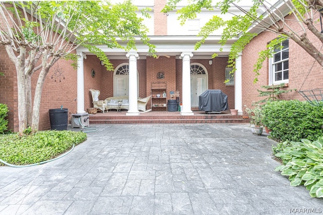 view of patio / terrace featuring a grill and covered porch