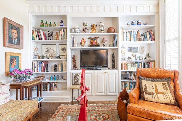 living area featuring dark wood-type flooring