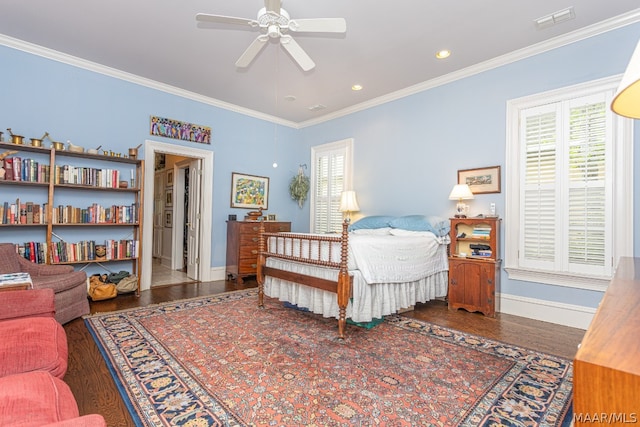 bedroom with hardwood / wood-style floors, ceiling fan, and crown molding