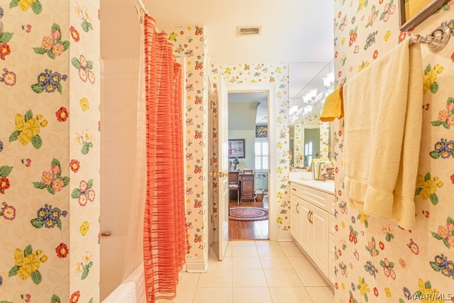 bathroom featuring shower / bath combo with shower curtain, tile floors, and large vanity