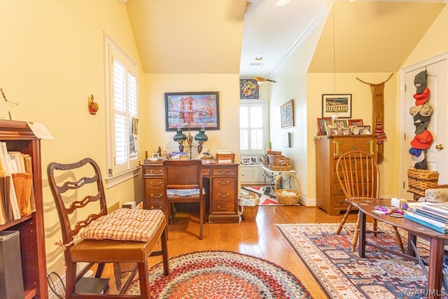 sitting room featuring lofted ceiling and hardwood / wood-style flooring