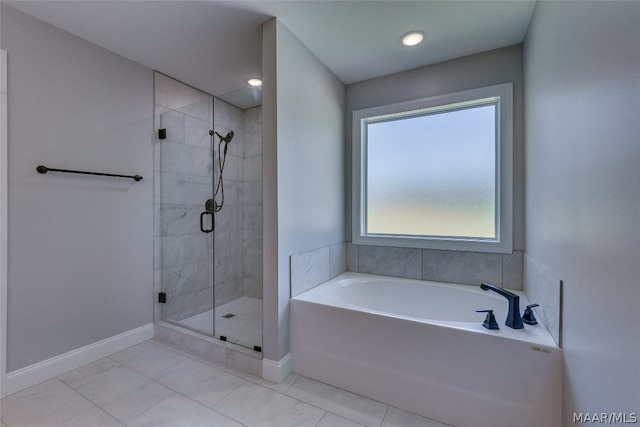 bathroom featuring separate shower and tub and tile patterned flooring