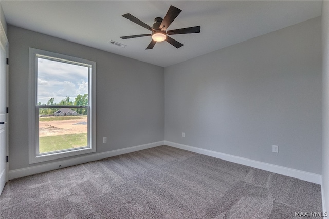 empty room with light carpet and ceiling fan