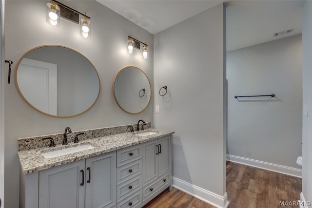 bathroom featuring vanity and hardwood / wood-style floors