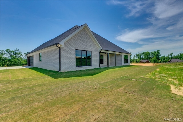 back of property featuring a lawn