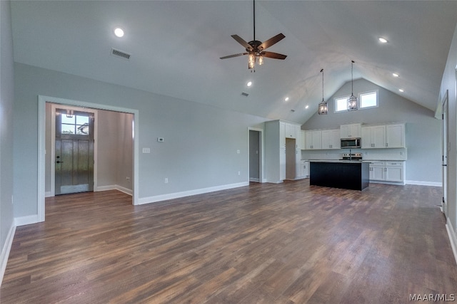 unfurnished living room with ceiling fan, high vaulted ceiling, and dark hardwood / wood-style floors