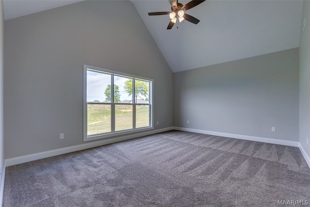 carpeted spare room featuring ceiling fan and high vaulted ceiling