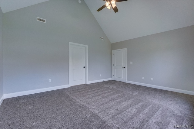 empty room with ceiling fan, high vaulted ceiling, and carpet flooring