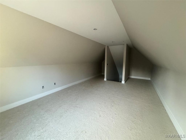 bonus room with vaulted ceiling