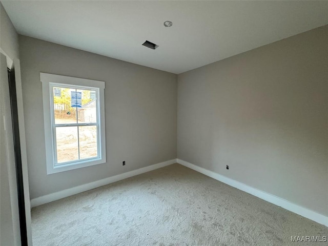 view of carpeted spare room