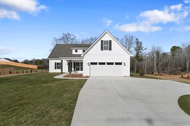 modern inspired farmhouse with a porch, a garage, and a front lawn