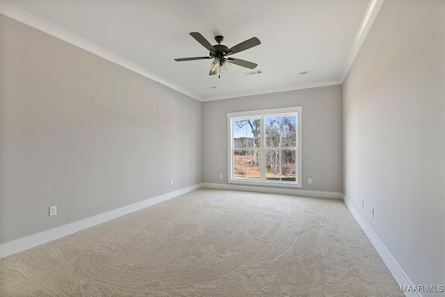 spare room with crown molding, light carpet, and ceiling fan