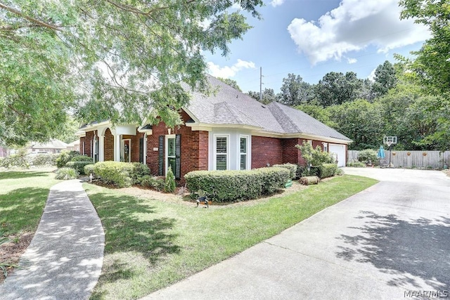 view of property exterior with a garage and a lawn