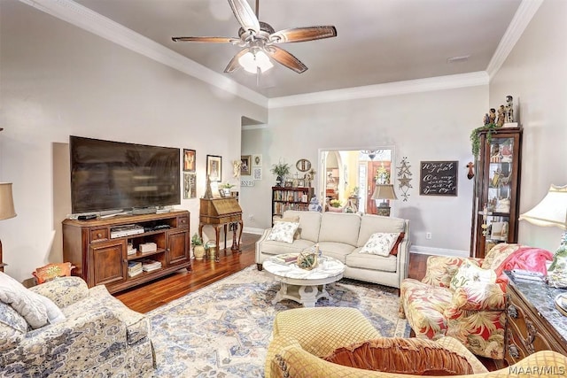 living room featuring hardwood / wood-style flooring, ceiling fan, and ornamental molding